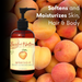 Apricot body oil bottle with apricots and text 'Softens and Moisturizes Skin, Hair & Body' on a dark background
