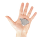 Small metallic device on a person's palm against a white background