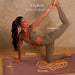 Woman in a yoga pose on a mat with 'Explore with Intention' text