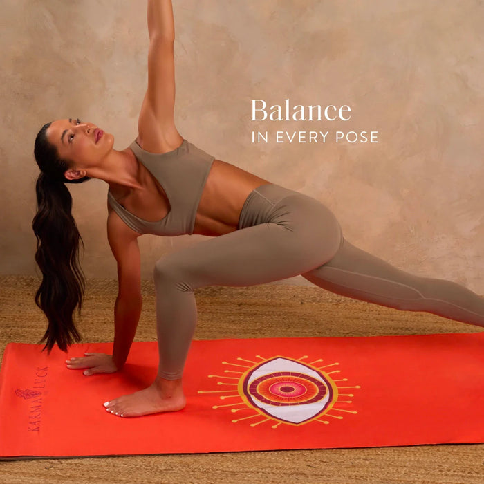 Woman in a yoga pose on a red mat with 'Balance IN EVERY POSE' text